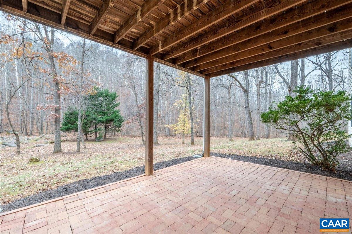 1411 Hill Hollow Road Faber, VA 22938 - Photo 35 of 50 a view of backyard with wooden fence and large trees