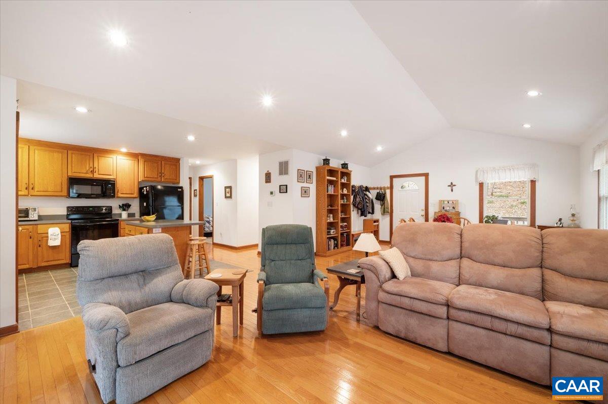 1411 Hill Hollow Road Faber, VA 22938 - Photo 6 of 50 a living room with furniture kitchen area and a view of kitchen