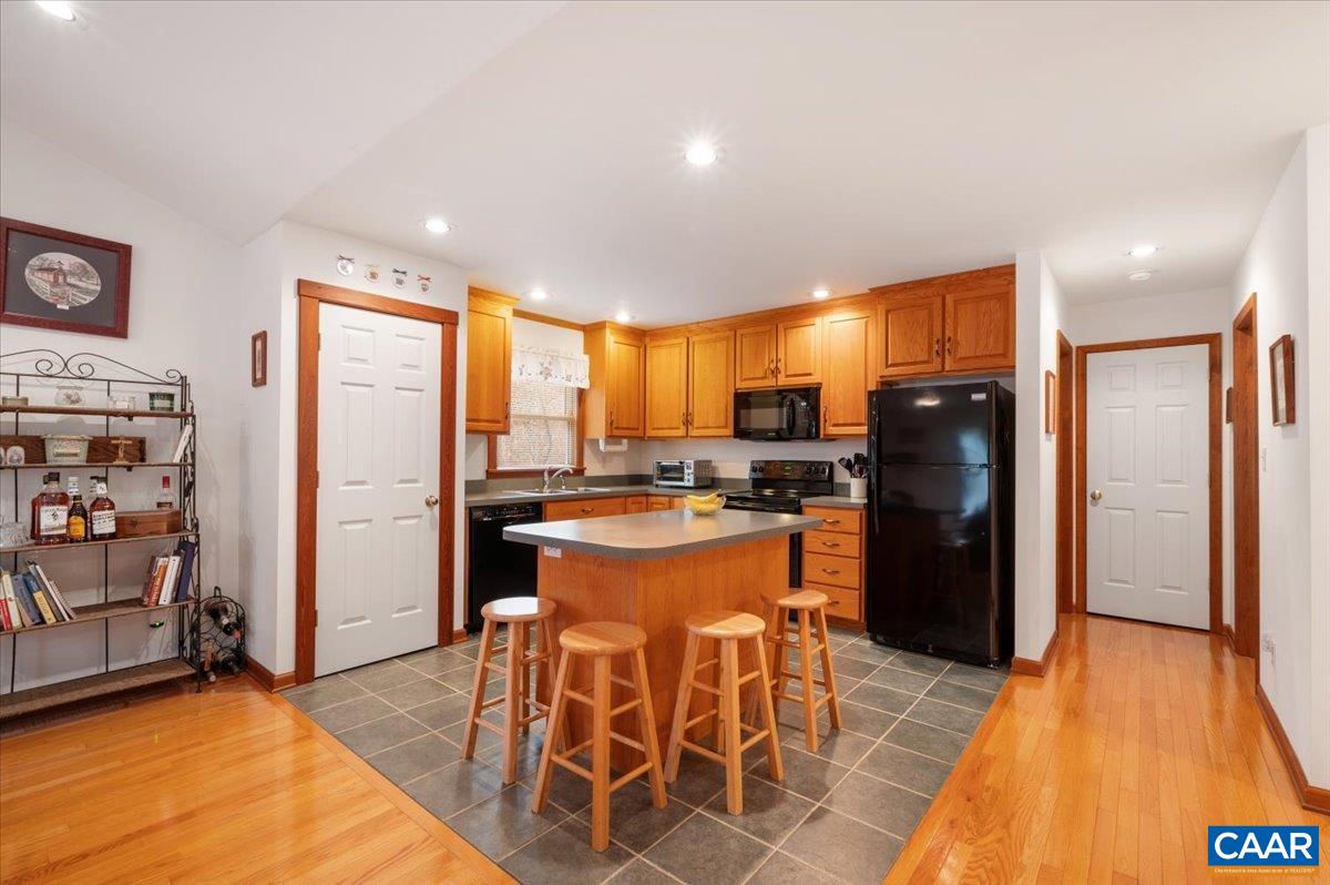1411 Hill Hollow Road Faber, VA 22938 - Photo 7 of 50 a kitchen with stainless steel appliances granite countertop a refrigerator and a stove top oven