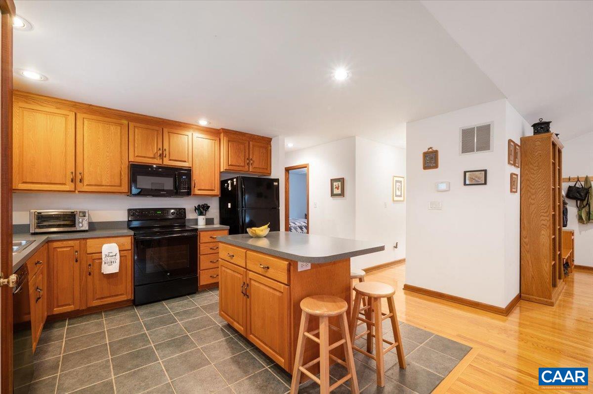 1411 Hill Hollow Road Faber, VA 22938 - Photo 8 of 50 a kitchen with stainless steel appliances granite countertop a refrigerator stove microwave and sink
