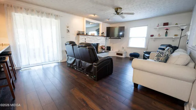 a living room with furniture and a fireplace