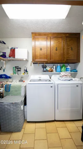 a utility room with washer and dryer