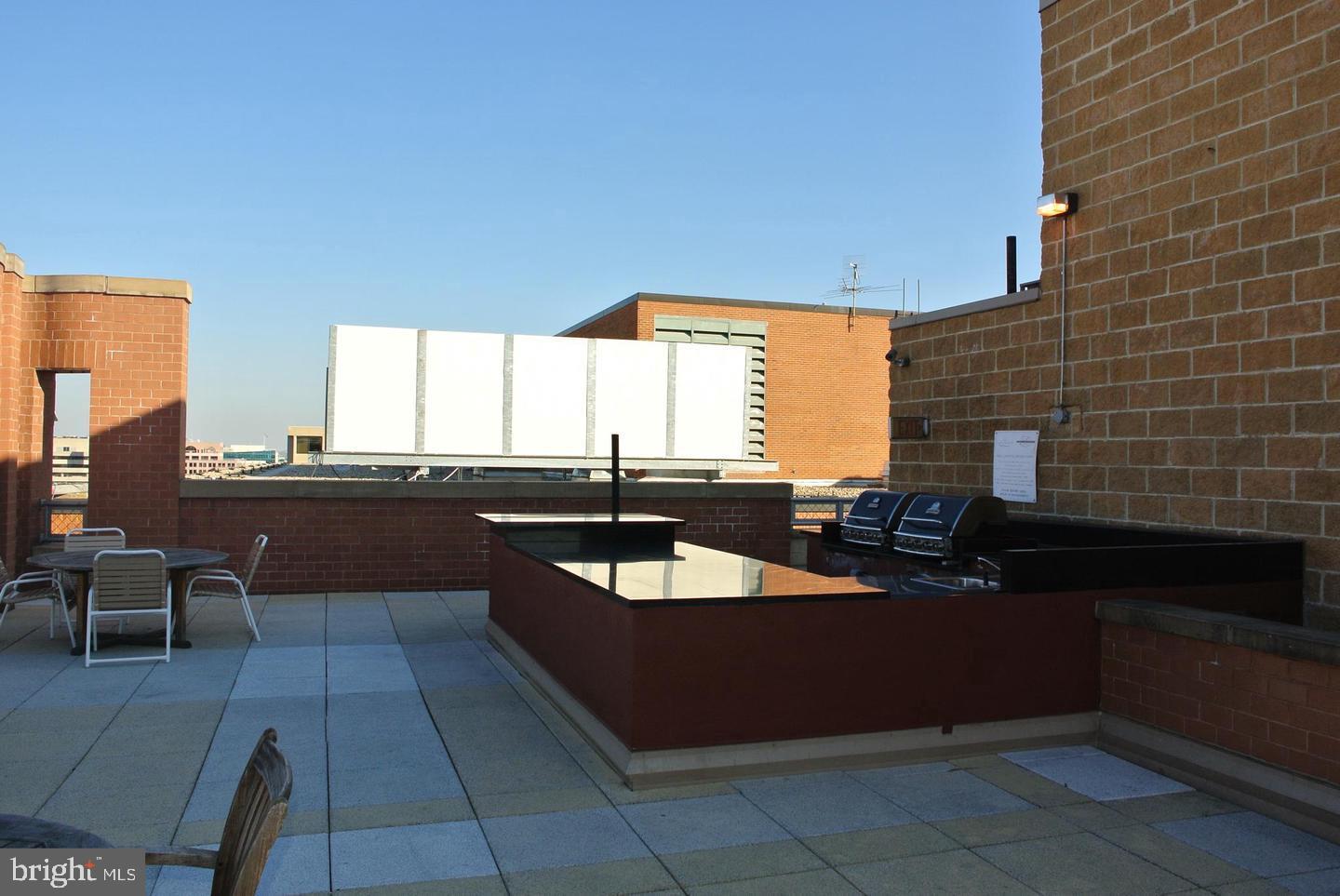 616 E Street Northwest, Unit 447 Washington, DC 20004 - Photo 25 of 28 a view of a patio with swimming pool
