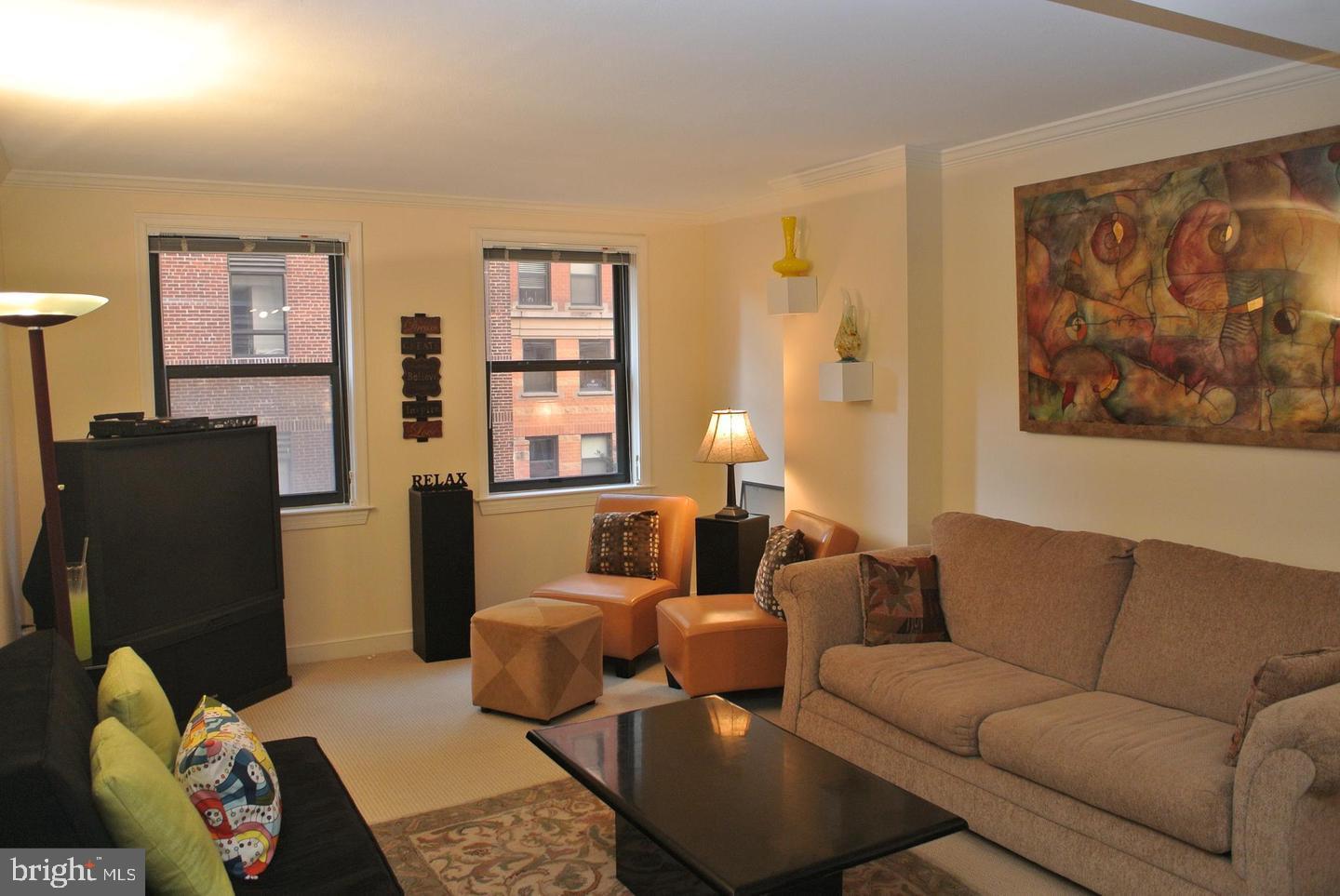 616 E Street Northwest, Unit 447 Washington, DC 20004 - Photo 28 of 28 a living room with furniture and wooden floor