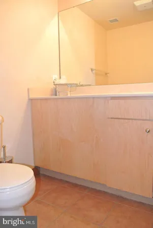 a bathroom with a toilet and a vanity