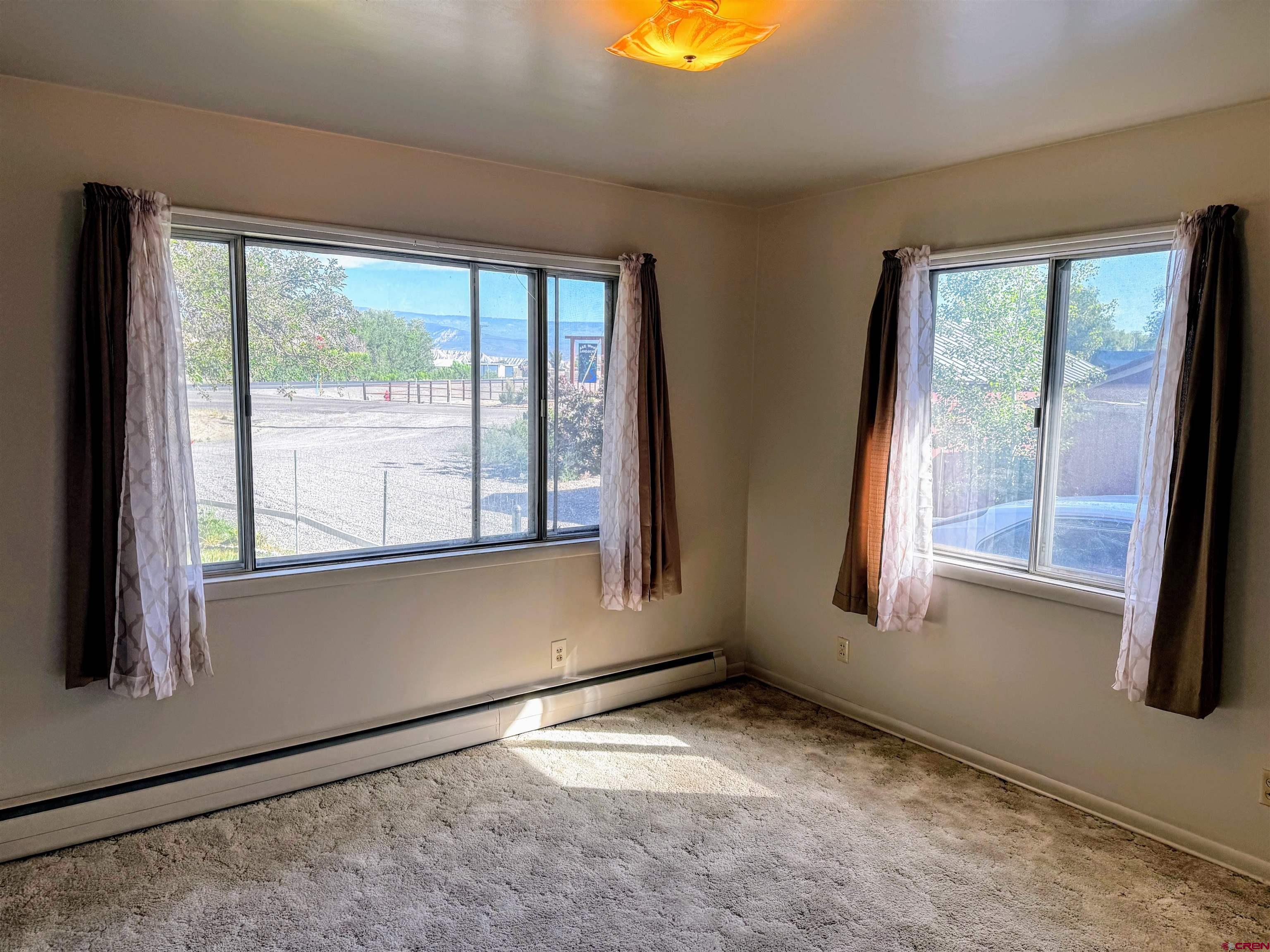 20114 Austin Road Austin, CO 81410 - Photo 16 of 26 a view of an empty room with a window