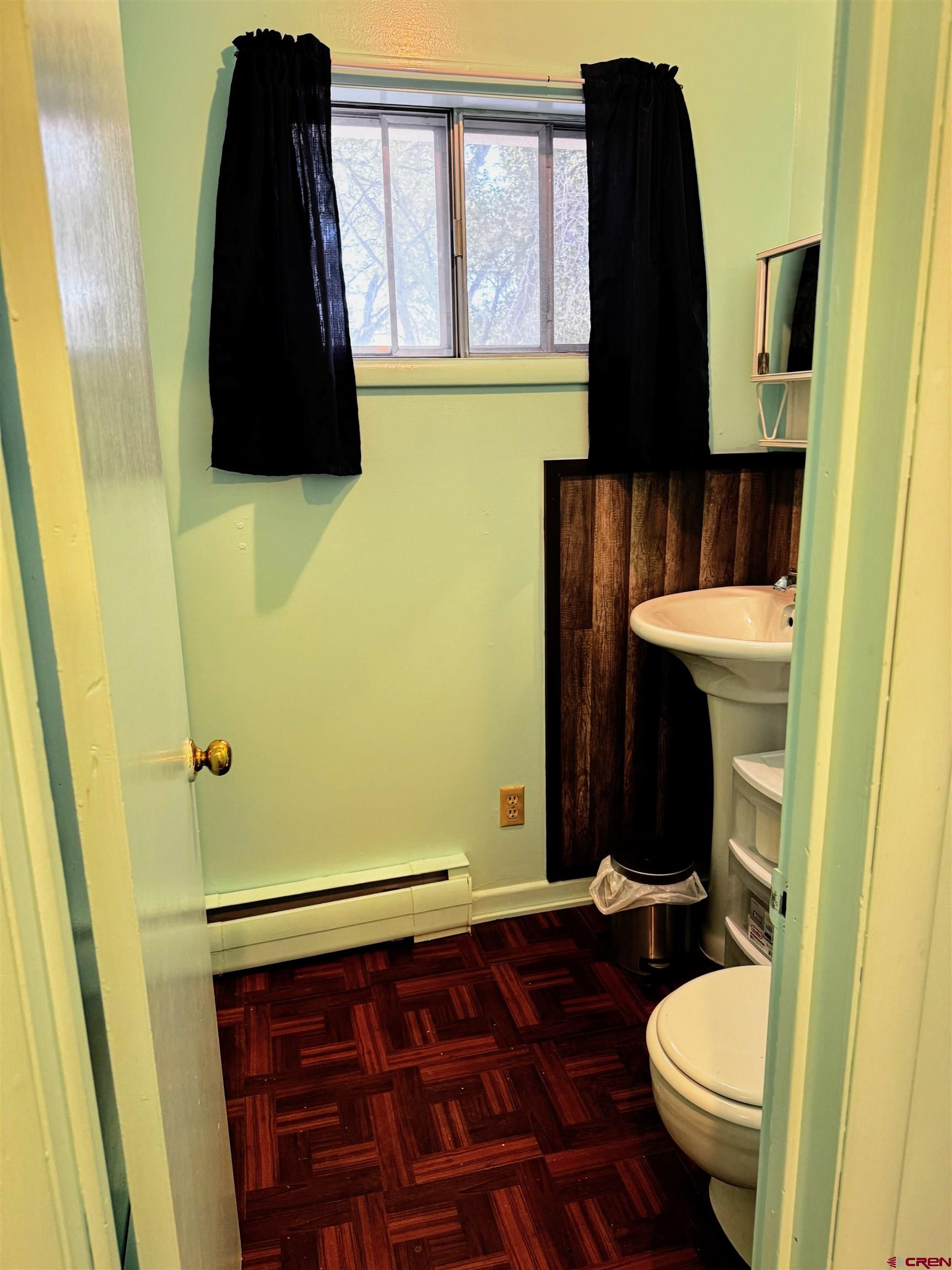 20114 Austin Road Austin, CO 81410 - Photo 7 of 26 a bathroom with a granite countertop toilet and a sink
