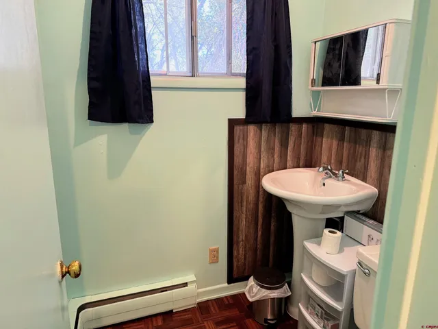 a bathroom with a sink and a toilet