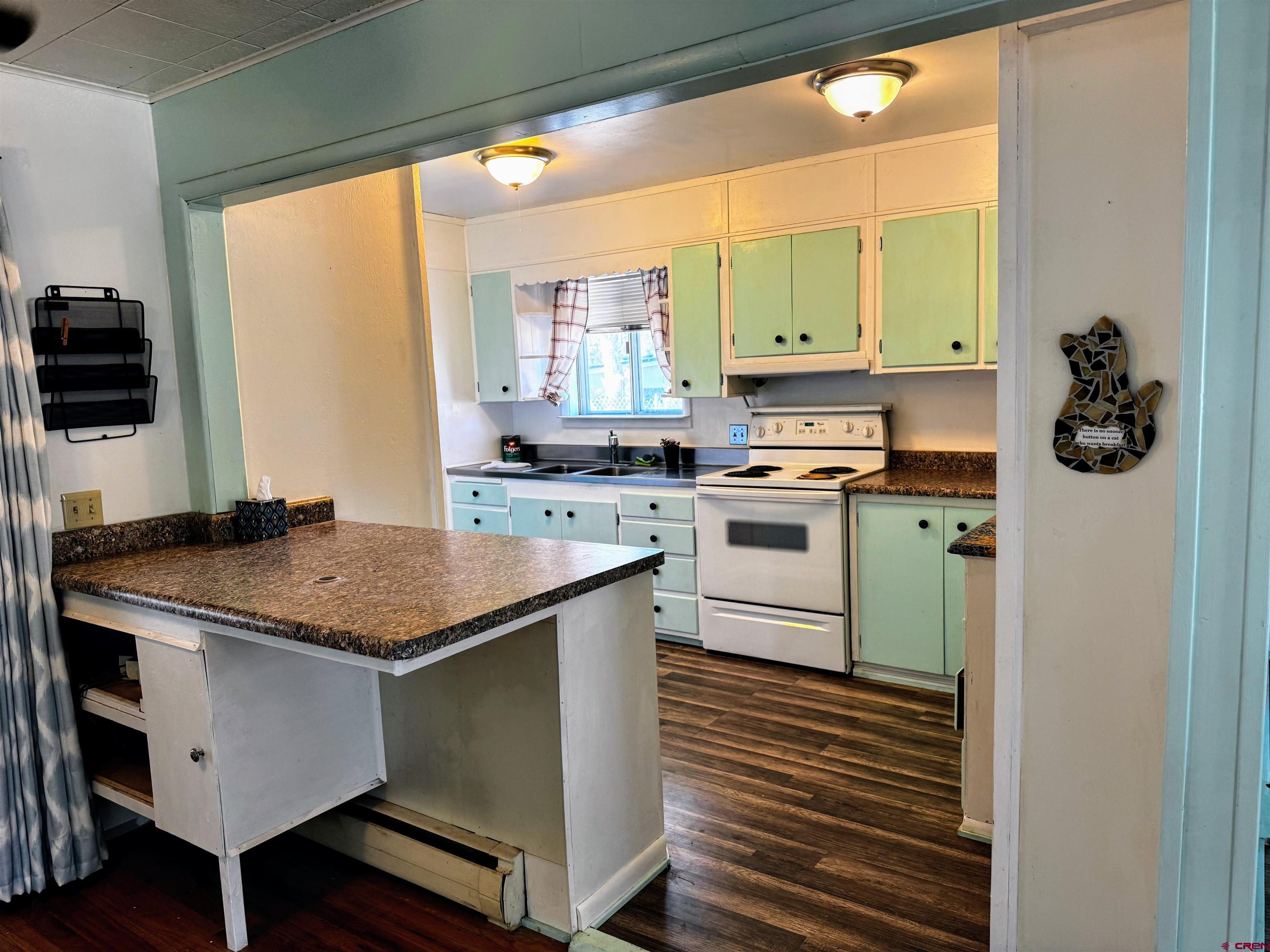20114 Austin Road Austin, CO 81410 - Photo 9 of 26 a kitchen with stainless steel appliances granite countertop a stove a sink and a microwave