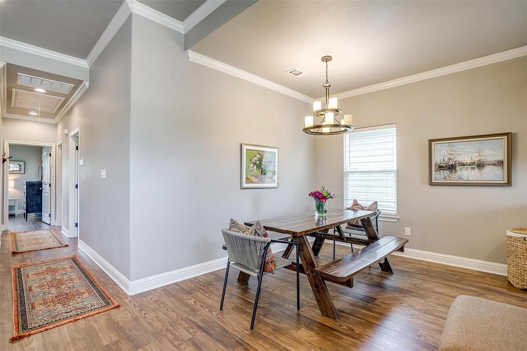 2708 James Road Granbury, TX 76049 - Photo 12 of 34 a view of a dining room with furniture window and wooden floor