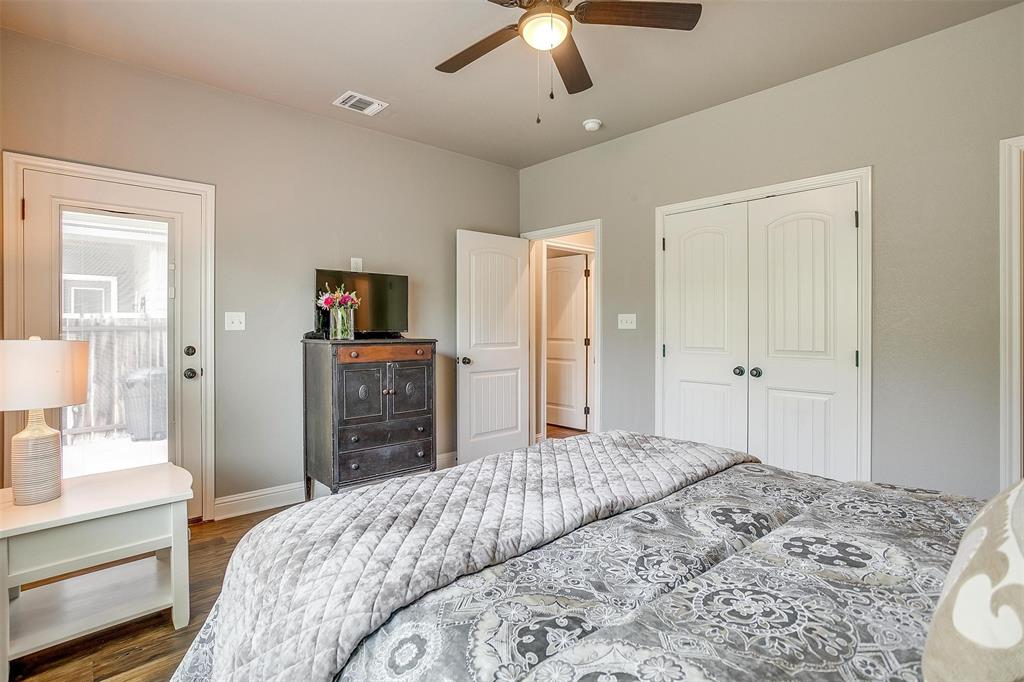 2708 James Road Granbury, TX 76049 - Photo 26 of 34 a bedroom with a bed and a dresser