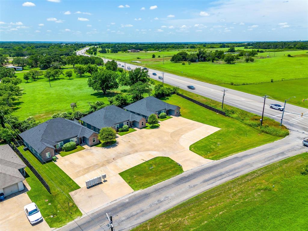 2708 James Road Granbury, TX 76049 - Photo 3 of 34 front view of a house with a yard
