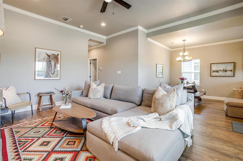 2708 James Road Granbury, TX 76049 - Photo 9 of 34 a living room with furniture and a wooden floor