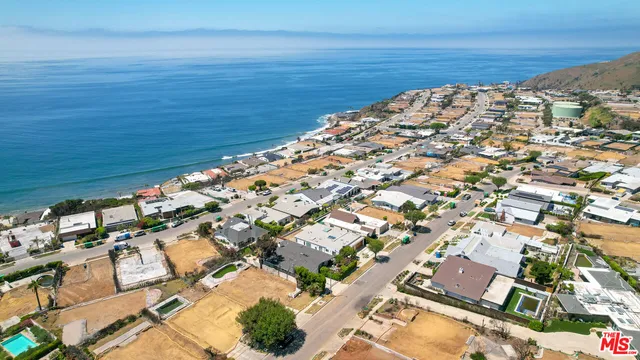 a view of a snow with a mountain in the background