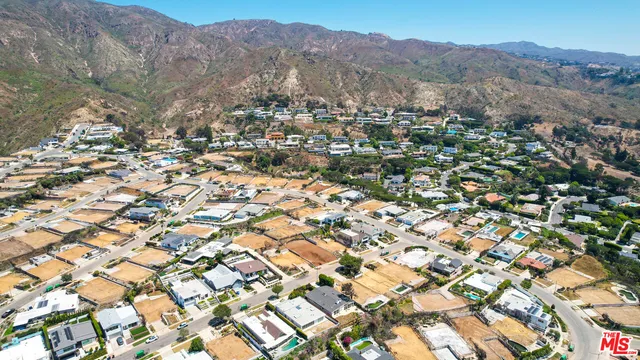 a house with trees in the background