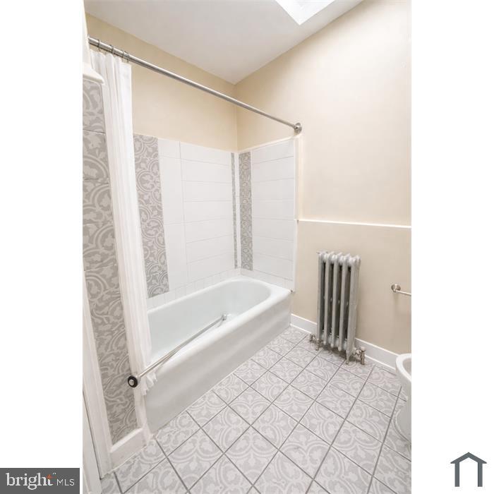 3219 North 29th Street Philadelphia, PA 19129 - Photo 13 of 17 a bathroom with a bathtub and a shower