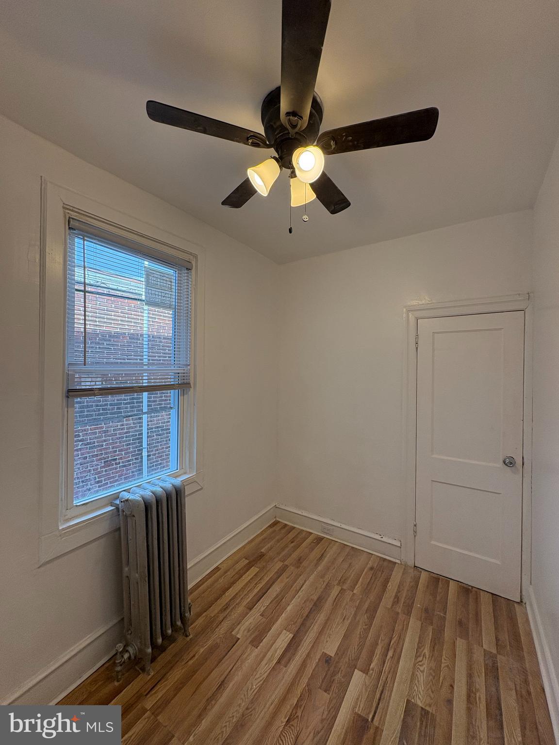 3219 North 29th Street Philadelphia, PA 19129 - Photo 14 of 17 a view of empty room with wooden floor and fan