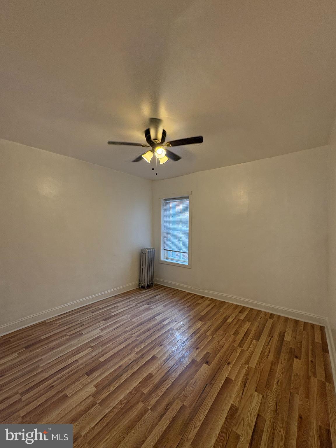 3219 North 29th Street Philadelphia, PA 19129 - Photo 15 of 17 a view of an empty room with wooden floor