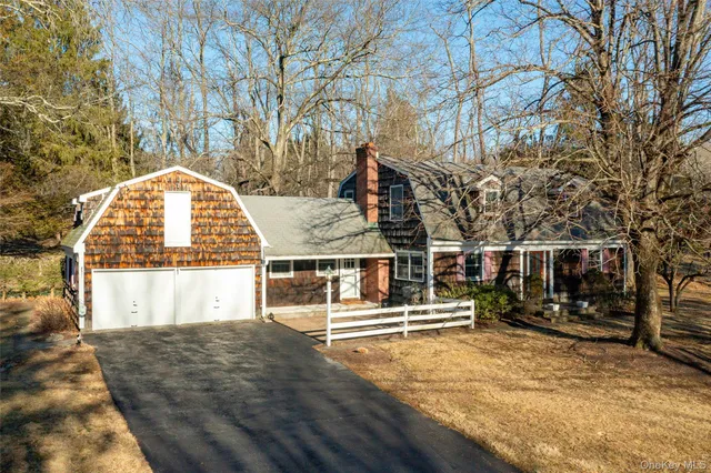 a view of a room with furniture wooden floor and windows