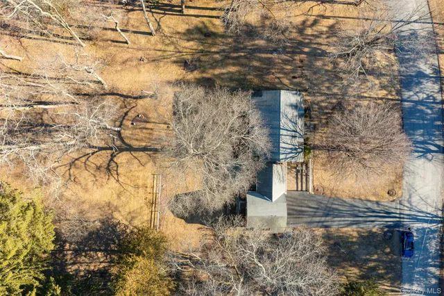 a view of a house with snow on the background
