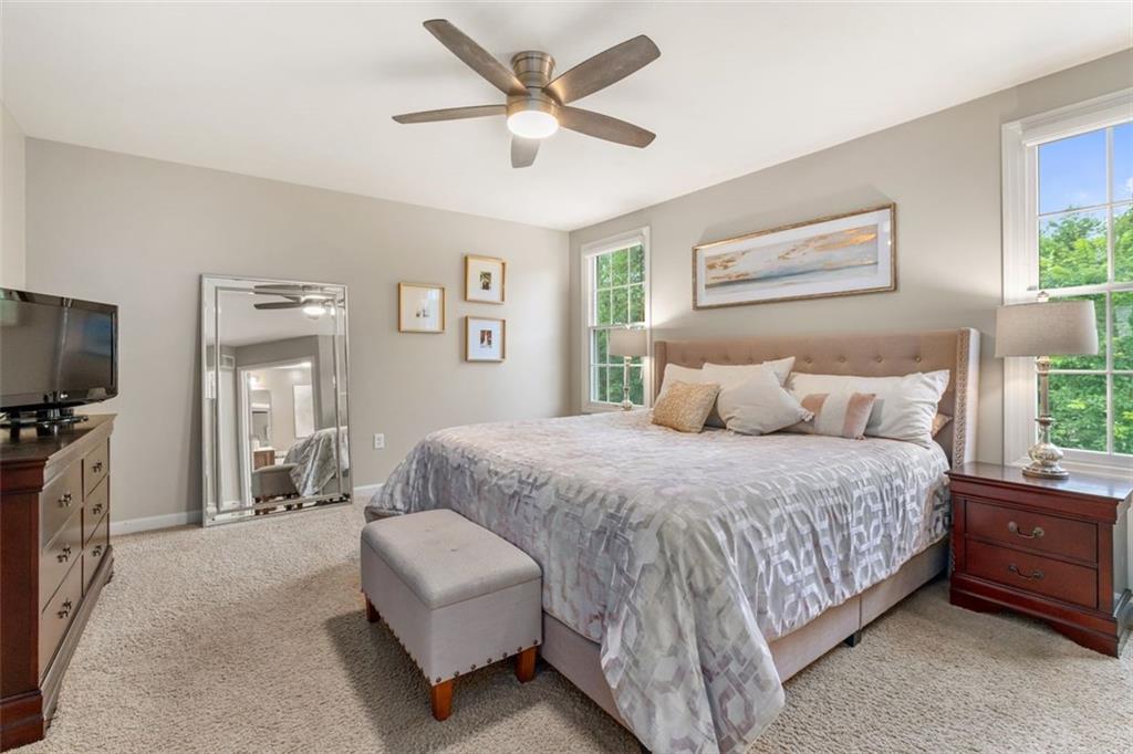 246 Overlook Court Coraopolis, PA 15108 - Photo 17 of 29 a bedroom with a large bed a flat screen tv and a couch