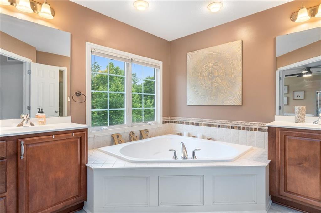 246 Overlook Court Coraopolis, PA 15108 - Photo 19 of 29 a bathroom with a tub sink and mirror