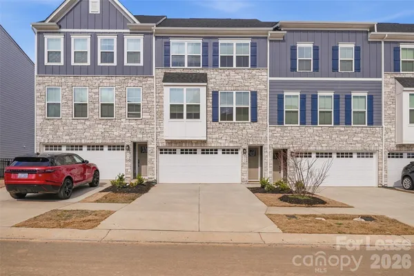 a front view of a building with parking