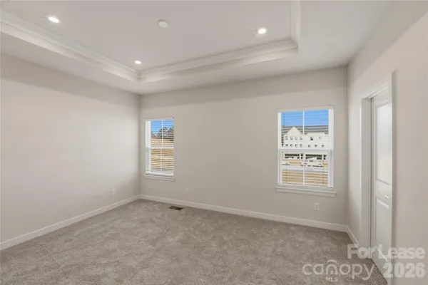 a view of an empty room and a window