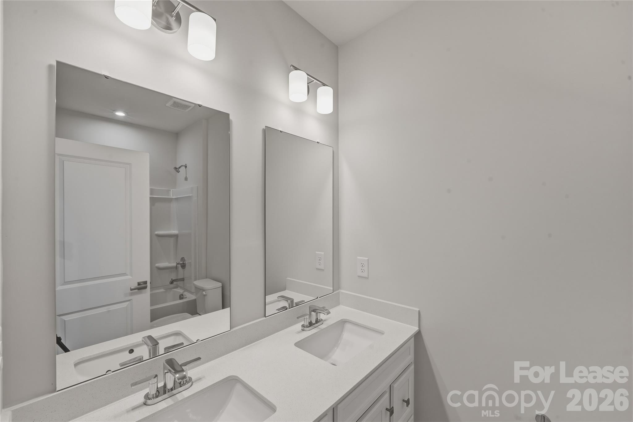 5032 Grain Orchard Road Indian Trail, NC 28079 - Photo 23 of 26 a bathroom with a sink vanity and a mirror