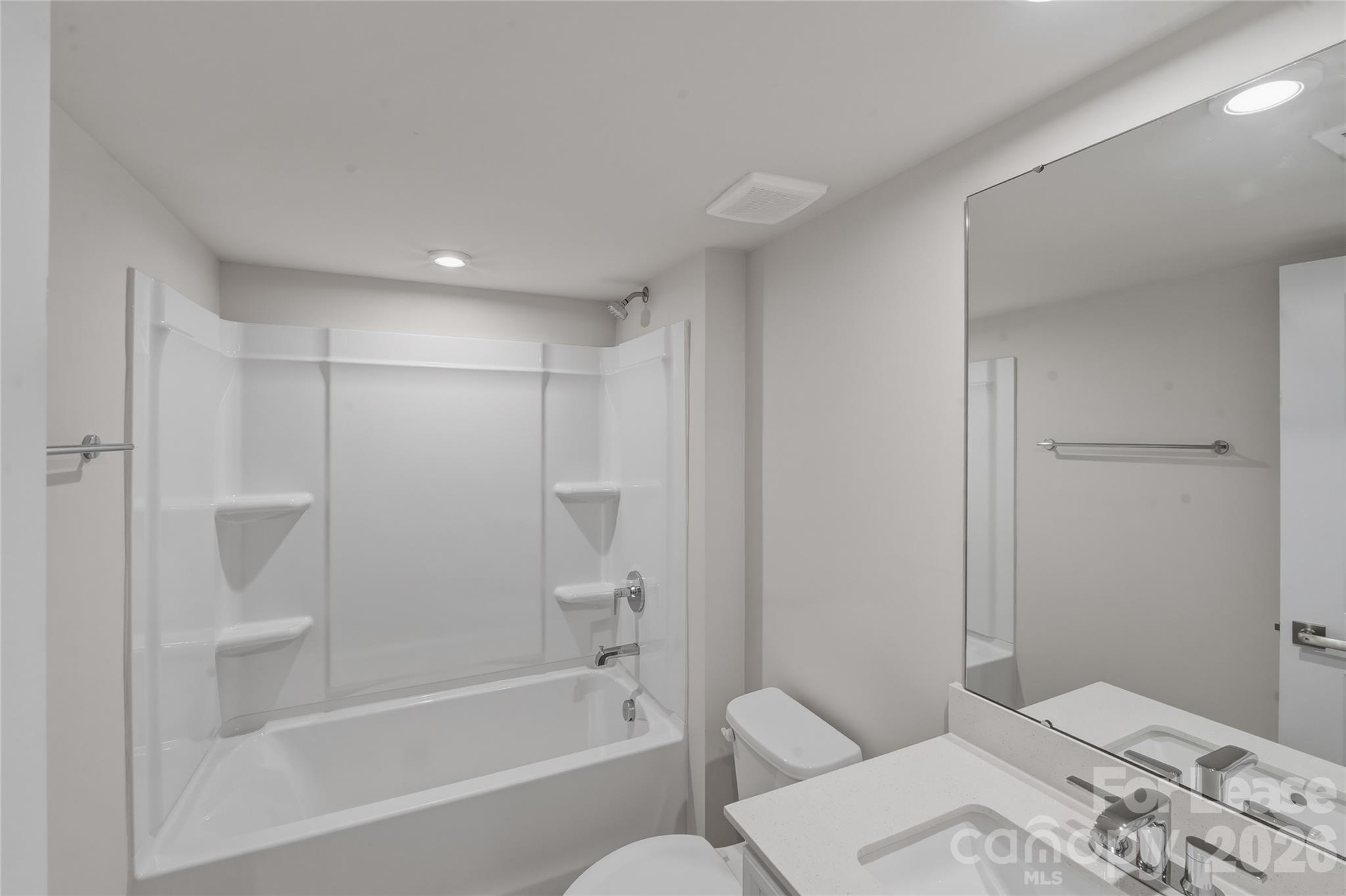 5032 Grain Orchard Road Indian Trail, NC 28079 - Photo 9 of 26 a bathroom with a bathtub and a toilet