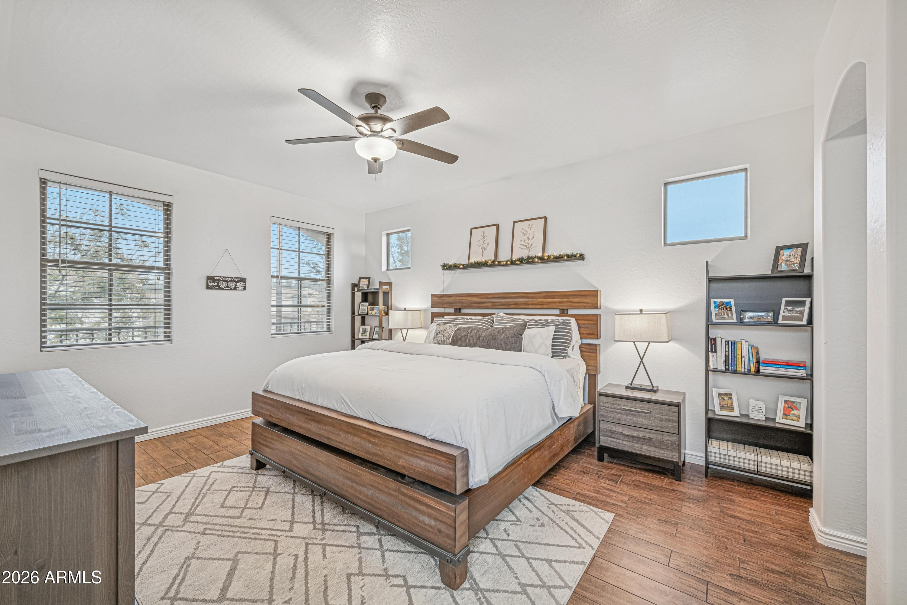 3942 South Mandarin Way Gilbert, AZ 85297 - Photo 13 of 32 a bedroom with a bed and a window