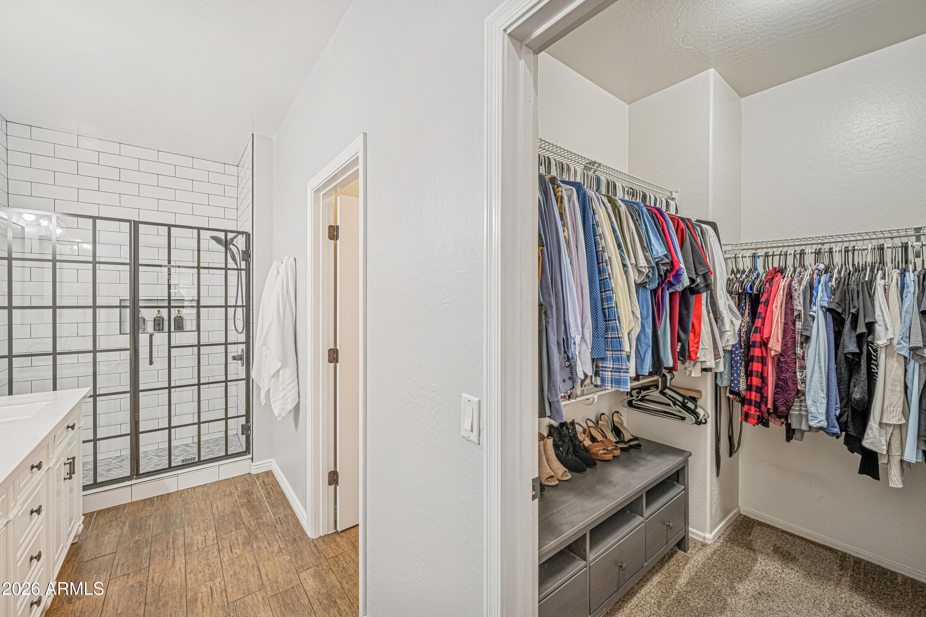 3942 South Mandarin Way Gilbert, AZ 85297 - Photo 16 of 32 a view of walk in closet with clothes