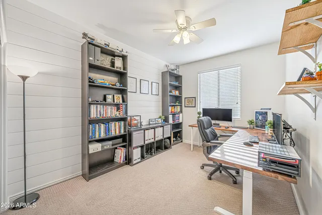 a front view of a house with yard and green space