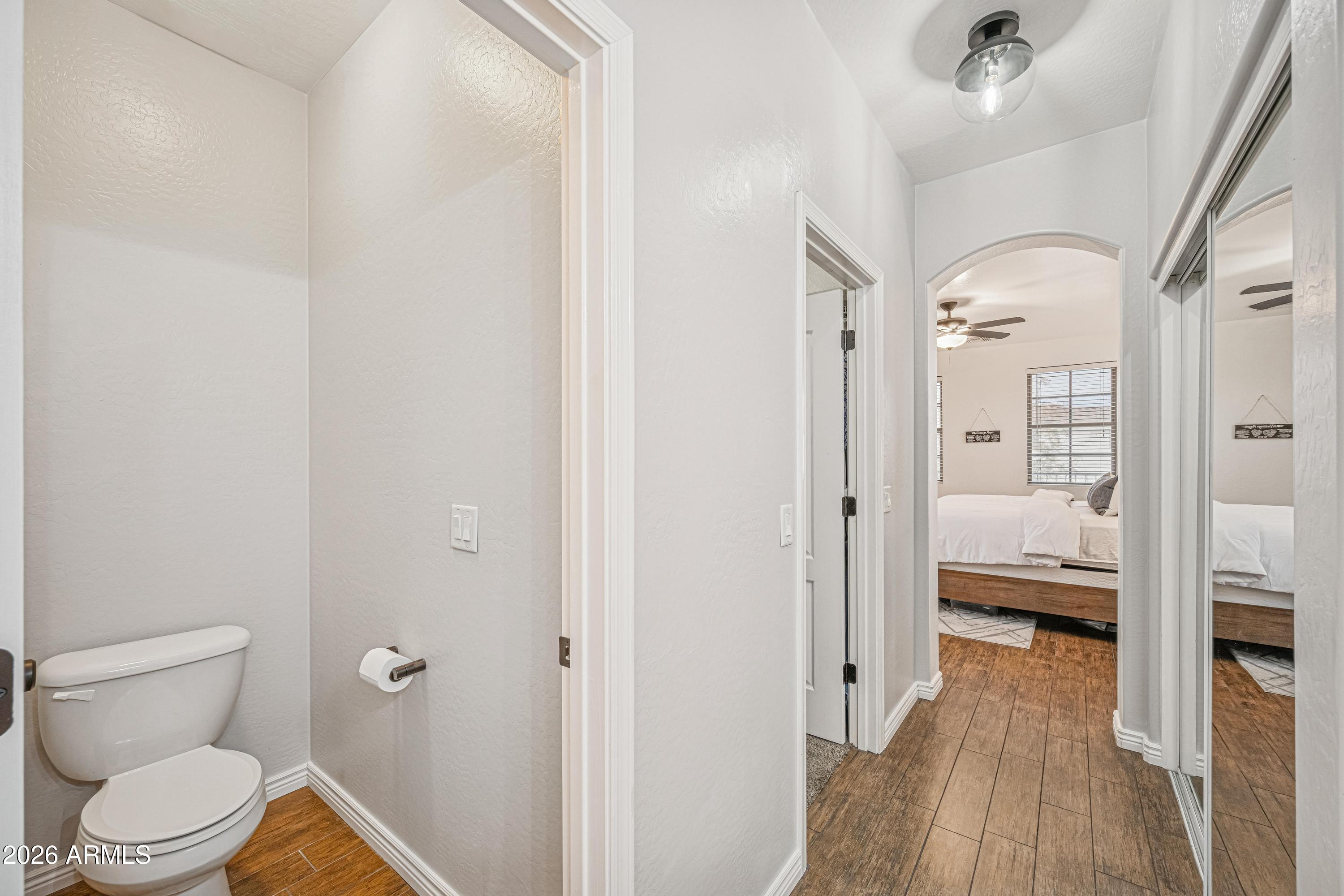 3942 South Mandarin Way Gilbert, AZ 85297 - Photo 24 of 32 a bathroom with a toilet and a shower