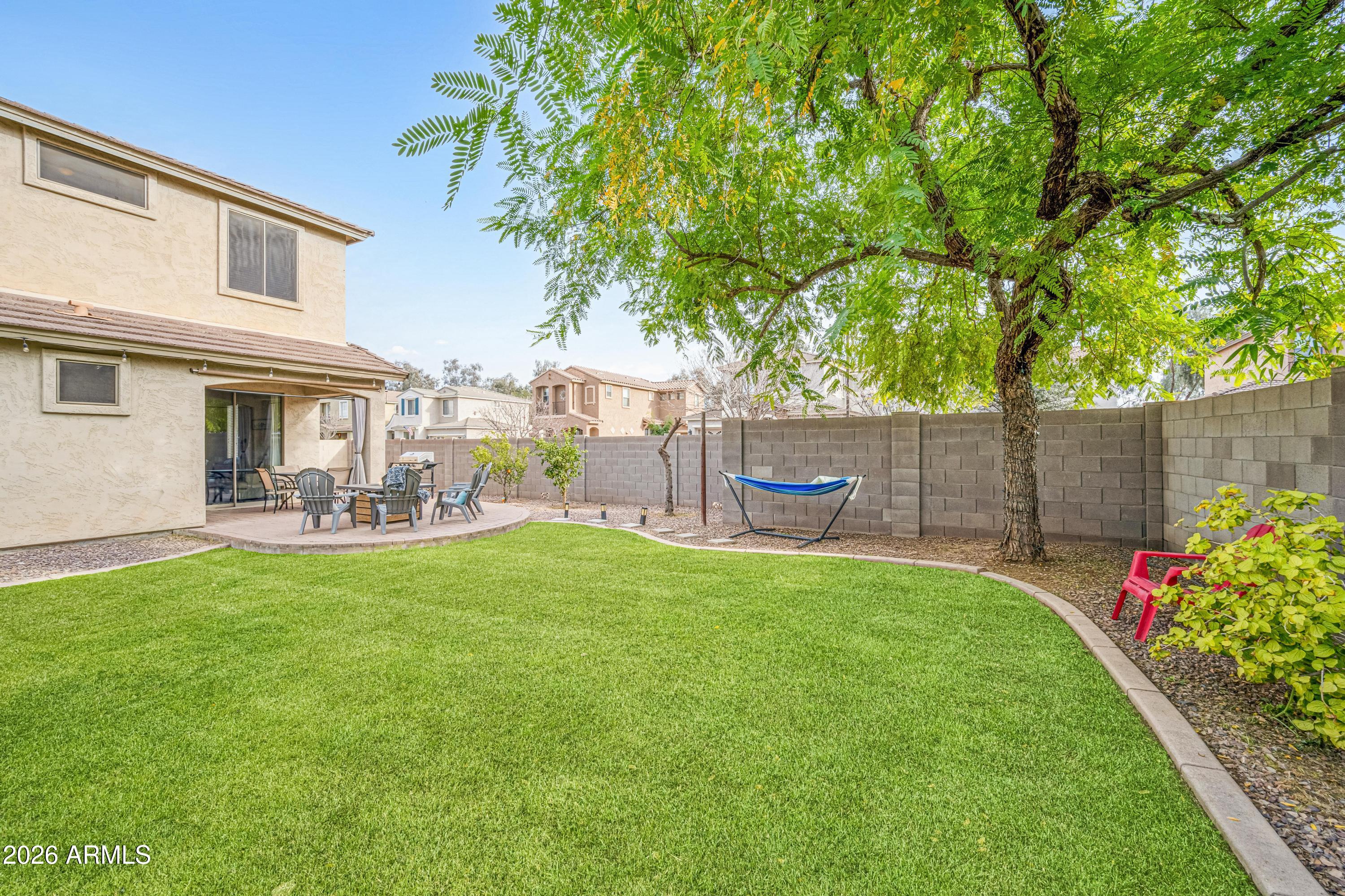 3942 South Mandarin Way Gilbert, AZ 85297 - Photo 27 of 32 a view of a yard with a slide
