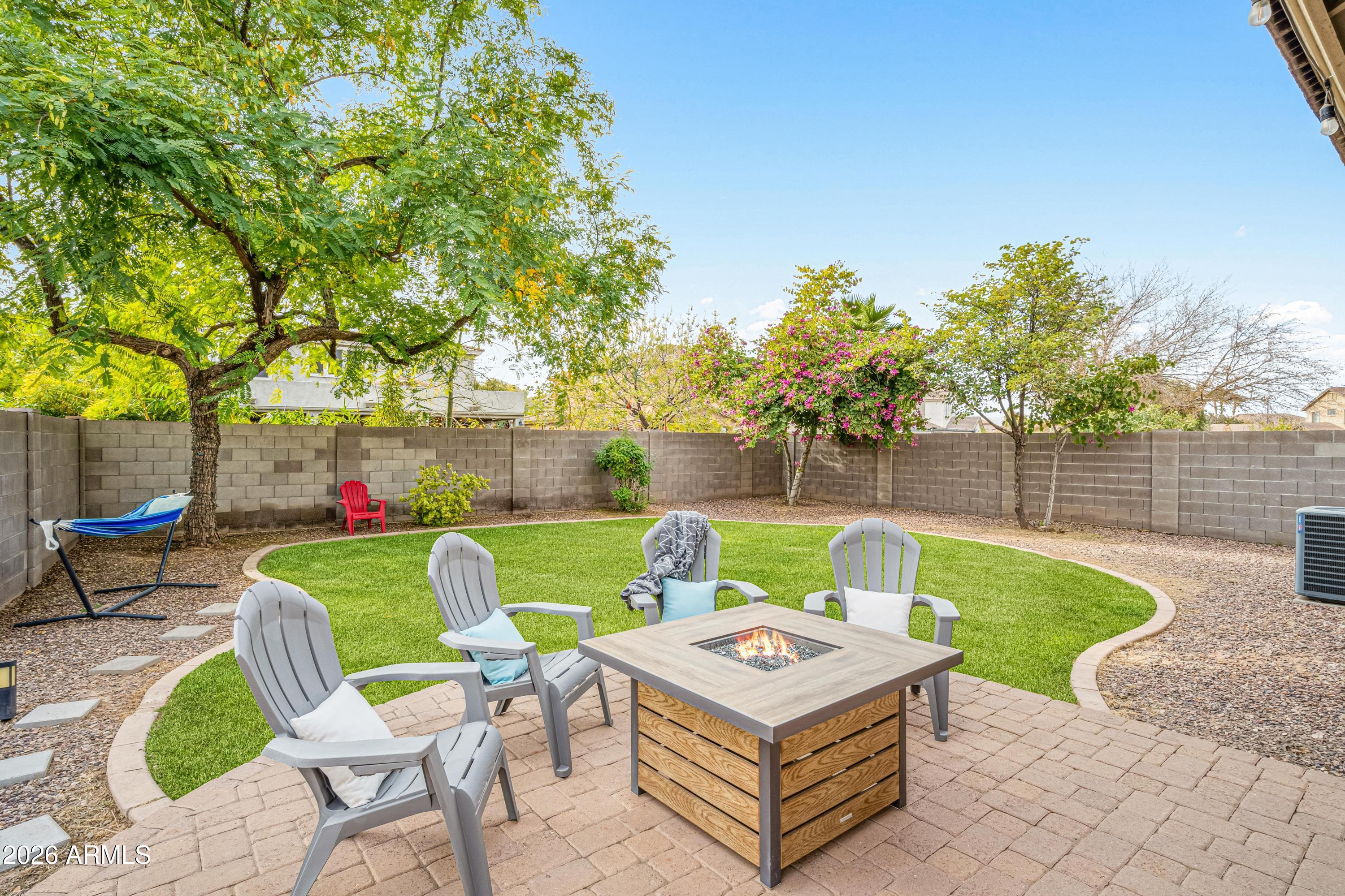 3942 South Mandarin Way Gilbert, AZ 85297 - Photo 2 of 32 a view of a chairs and table in patio