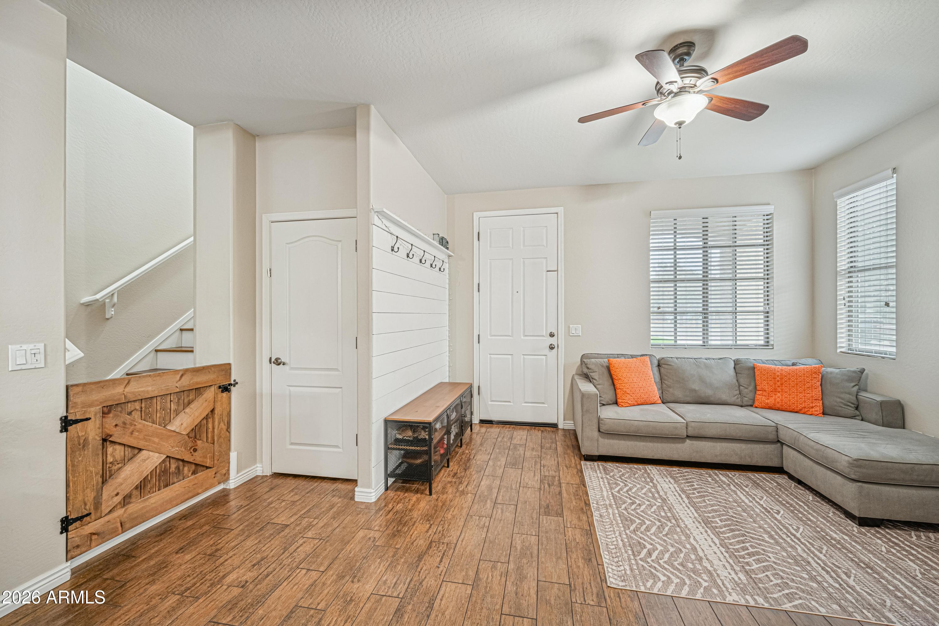 3942 South Mandarin Way Gilbert, AZ 85297 - Photo 4 of 32 a living room with furniture and a rug