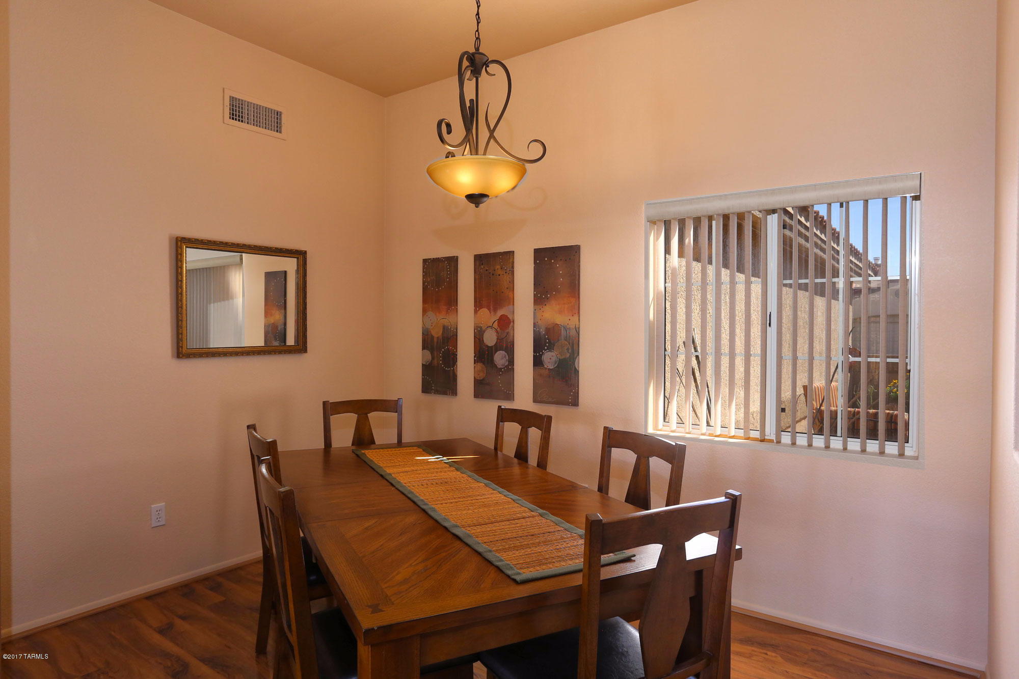 1065 East Royal Oak Road Oro Valley, AZ 85755 - Photo 8 of 19 a view of a dining room with furniture window and wooden floor
