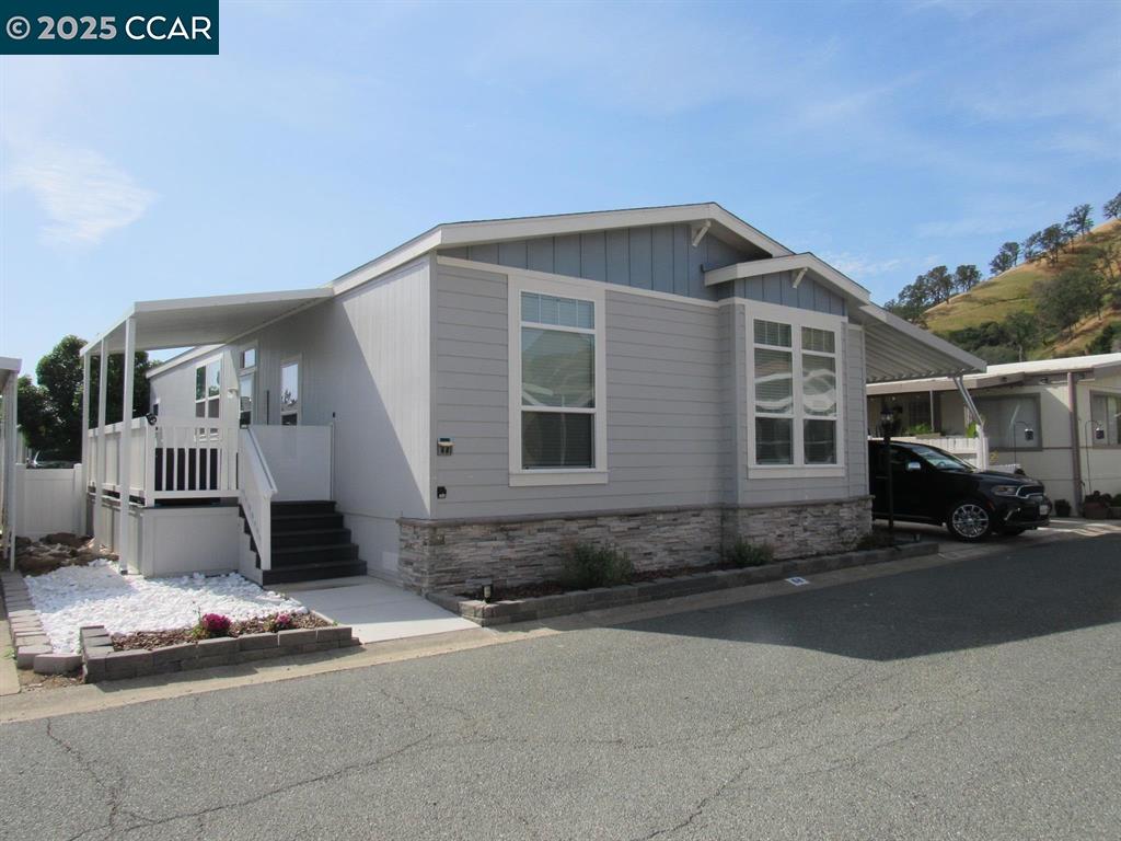 16711 Marsh Creek Road, Unit 68 Clayton, CA 94517 - Photo 1 of 1 a front view of a house with a garage