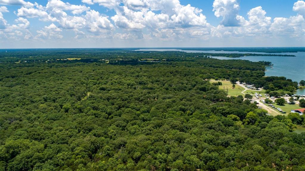 1 County Road 3706 Road Quinlan, TX 75474 - Photo 2 of 10 a view of a field of grass and trees