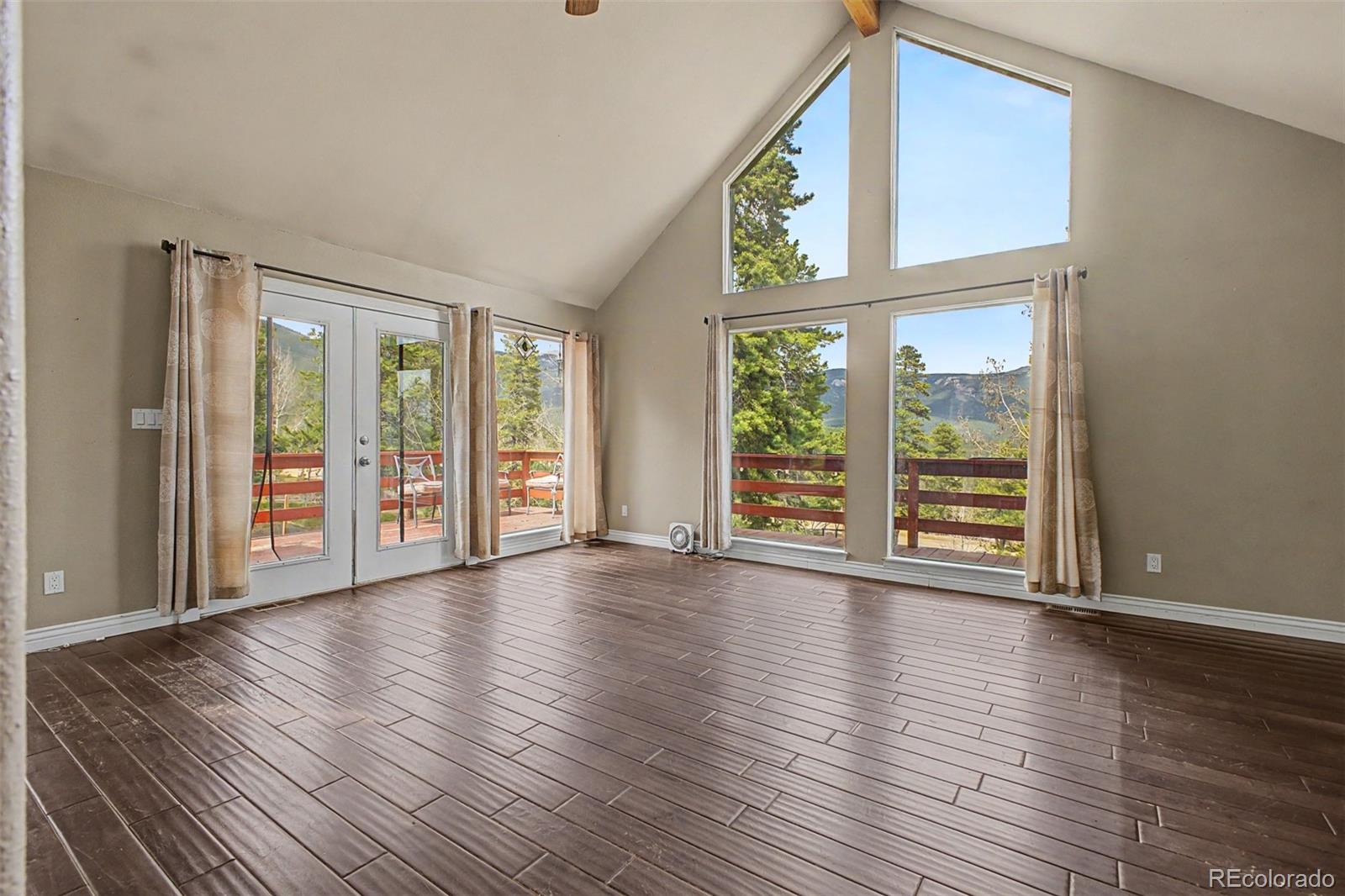 76 Highlands Drive Bailey, CO 80421 - Photo 16 of 49 a view of an entryway with wooden floor