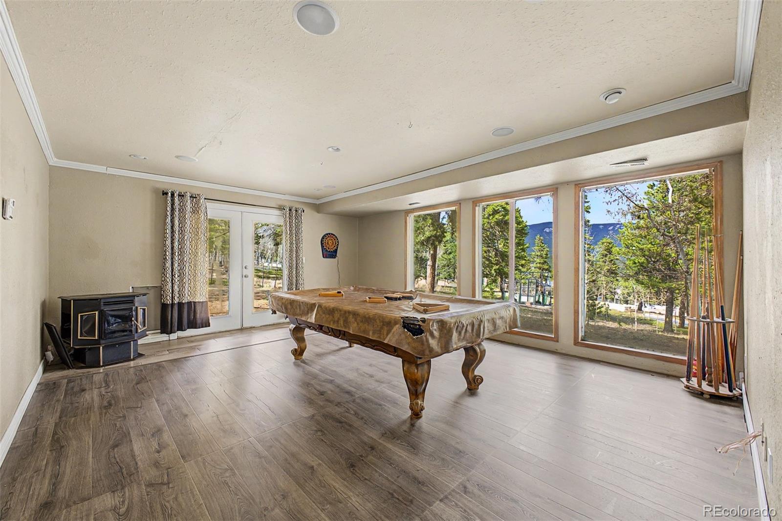 76 Highlands Drive Bailey, CO 80421 - Photo 20 of 49 a living room with furniture and a wooden floor