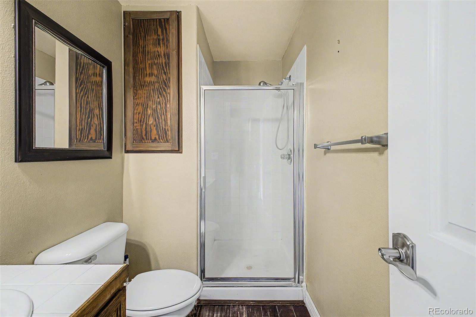 76 Highlands Drive Bailey, CO 80421 - Photo 26 of 49 a white toilet sitting next to a bathroom sink