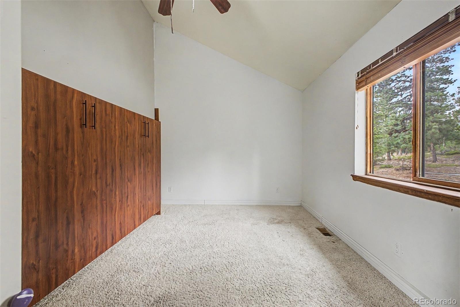 76 Highlands Drive Bailey, CO 80421 - Photo 30 of 49 a view of an empty room with a window