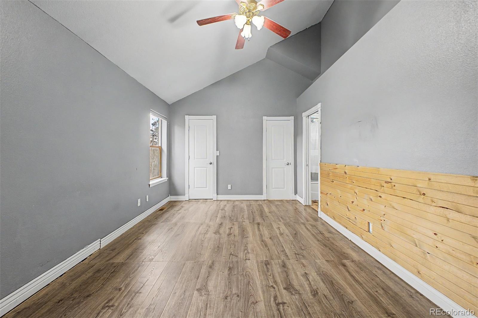 76 Highlands Drive Bailey, CO 80421 - Photo 32 of 49 wooden floor in an empty room with a window