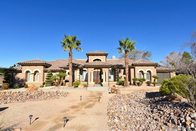 12489 Reata Road Apple Valley, CA 92308 - Photo 1 of 1 a view of a house with a snow on the road