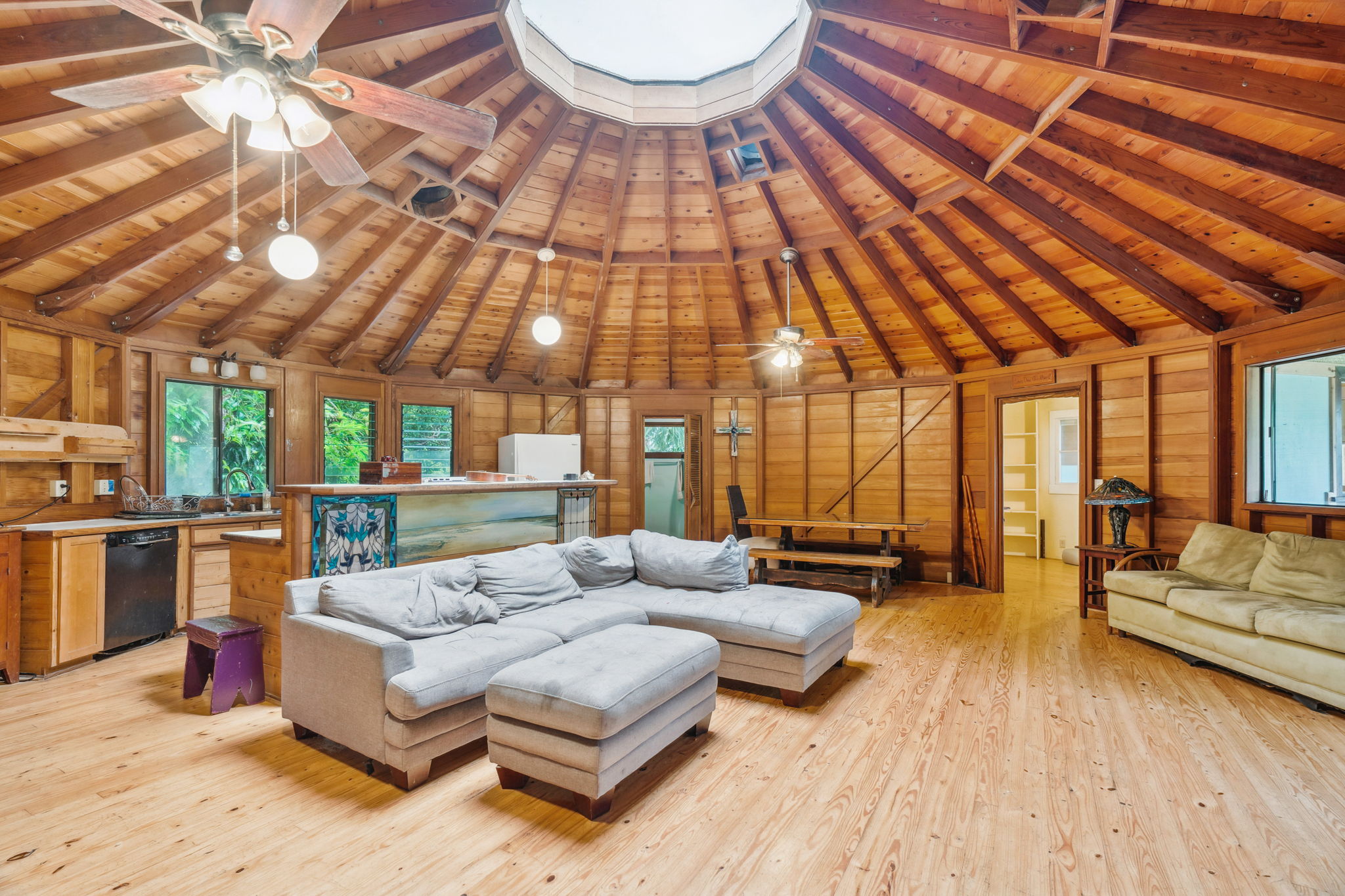 5051 Wainiha Powerhouse Road Hanalei, HI 96714 - Photo 2 of 28 a living room with furniture and a chandelier