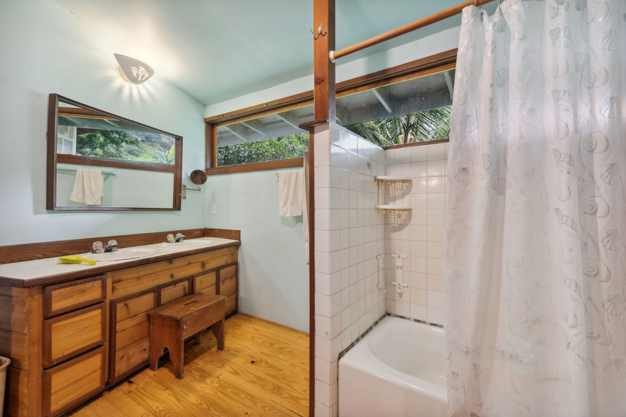 5051 Wainiha Powerhouse Road Hanalei, HI 96714 - Photo 10 of 28 a view of a bedroom with furniture and window