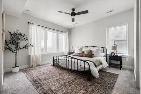 a bed room with a bed and a chandelier
