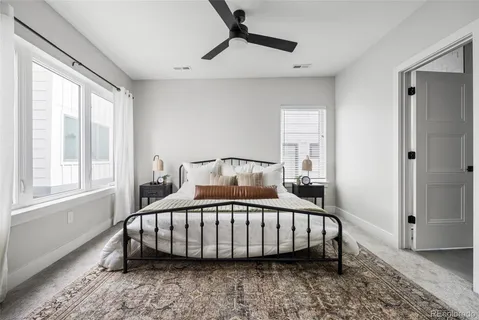 a bedroom with a bed and window